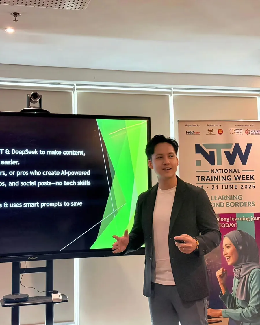 Edison presenting on stage at the HRD Corp National Training Week 2025 event.